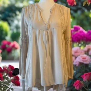 Women’s Blu Pepper long sleeve top. This top features very detailed stitching.